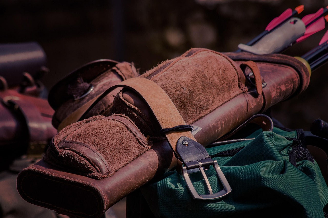 Leather hunting pouch with belt and arrows